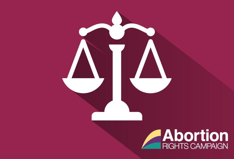 Image of white scales (of justice) on a maroon background, the ARC logo is in the bottom right corner