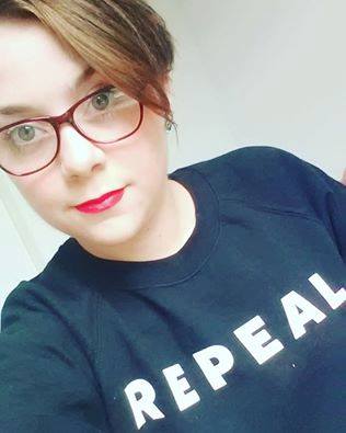 Photograph of Aideen O'Shaughnessy wearing a Repeal jumper