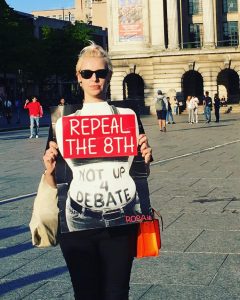 Caroline Barry pictured holding a placard that reads "Repeal the 8th Not up 4 Debate"