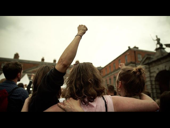 A portion crowd at Dublin castle as the result was announced, pictured from behind