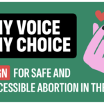 against a green background, is a back rectangle with white letter in caps that reads "MY VOICE MY CHOICE". Beneath this it reads "Sign for safe and accessible abortion in the EU!" in white lettering . Sign is highlighted in red. To the right of this is a pink hand with the index and thumb crossed over each other. above the fingers is a red heart